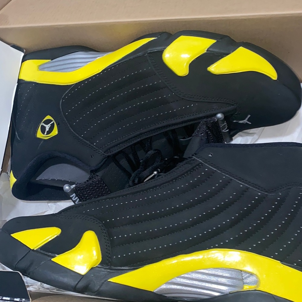 Black and yellow Jordan retro 14s